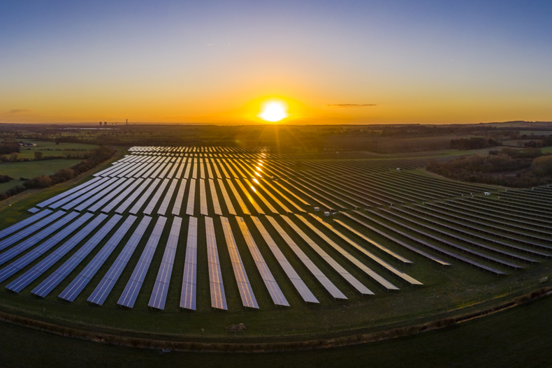 solar site with sun setting in background